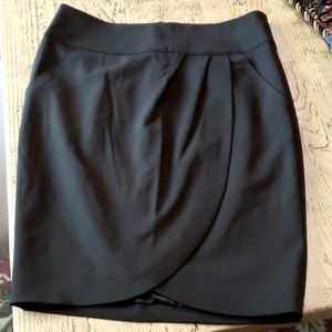 Black, above the knee length skirt with pockets
